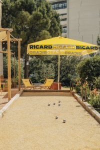 Pétanque court with a Ricard parasol in the garden of the InterContinental Marseille Hôtel-Dieu